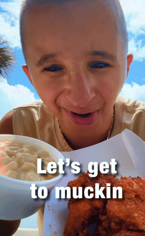 A Boy Is Holding A Bowl Of Macaroni And Cheese And A Plate Of Fried Chicken With The Caption Let 'S Get To Mucking GIF