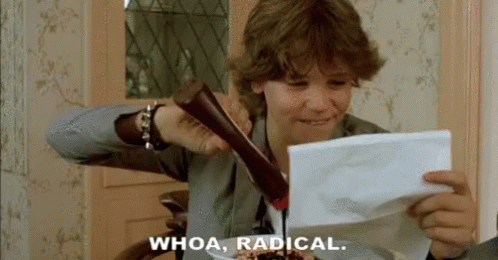 A Boy Is Holding A Piece Of Paper That Says " Whoa Radical " GIF