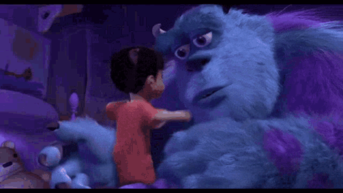 A Boy Is Hugging A Purple Monster From The Movie Monsters Inc . GIF