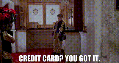 A Boy Is Standing In A Room With The Words `` Credit Card ? You Got It '' Written On The Bottom . GIF