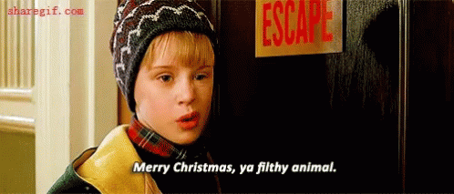 A Boy Is Standing In Front Of A Door With A Sign That Says Escape . GIF