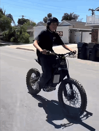 A Boy Riding A Dirt Bike With The Number 427 On The Front GIF