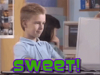 A Boy Sitting In Front Of A Computer With The Word Sweet Written On It GIF