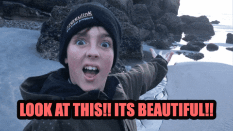 A Boy Wearing A Black Beanie Says Look At This GIF