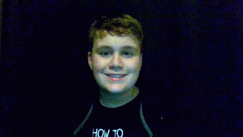 Boy In Black Shirt Holding Blue Toy Gun GIF