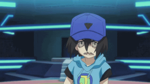 A Boy Wearing A Blue Hat With A Triangle On It GIF