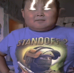 A Boy Wearing A Blue Shirt That Says " Standoff 2 " GIF