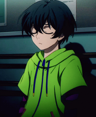 A Boy Wearing A Green Hoodie With Blue Strings Is Sitting With His Eyes Closed GIF