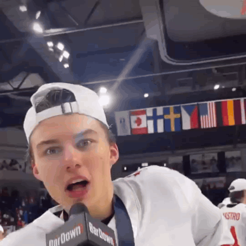 A Boy Wearing A Hat And A Microphone That Says Bardown GIF