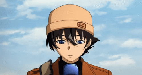 A Boy Wearing A Hat With The Letter G On It Looks At The Camera GIF