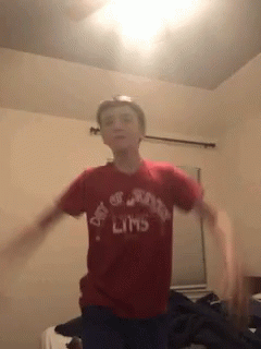 A Boy Wearing A Red Shirt That Says Day Of The Limbs On It GIF