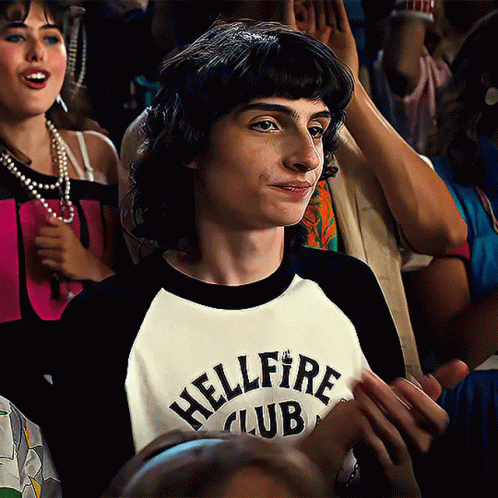 A Boy Wearing A Shirt That Says Hellfire Club On It GIF