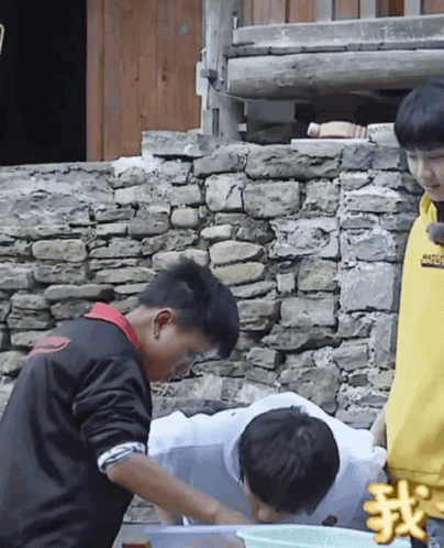 A Boy Wearing A Yellow Sweatshirt That Says ' Supreme ' On It Stands Next To A Boy In A Black Jacket GIF
