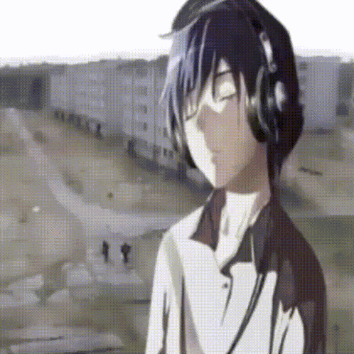 A Boy Wearing Headphones Is Listening To Music GIF