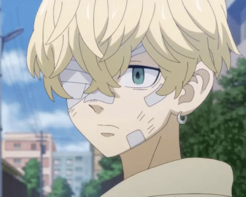 A Boy With A Bandage On His Face Looks At The Camera GIF