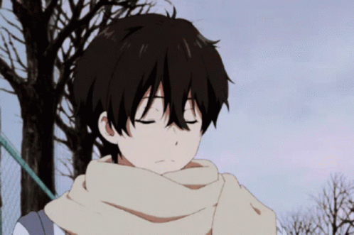A Boy With A Scarf Around His Neck Looks Down At Something GIF