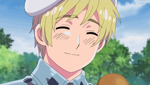 a boy with blonde hair and a white hat is smiling with a tear running down his face