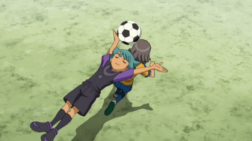 a boy with blue hair is holding a soccer ball over his head