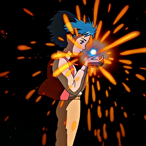 A Boy With Blue Hair Is Holding Something In His Hands GIF