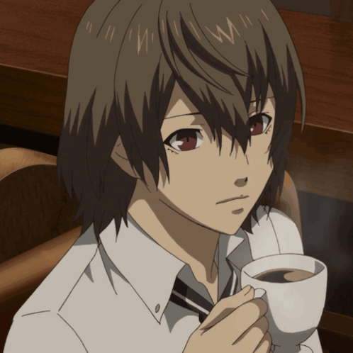 A Boy With Brown Hair Is Holding A Cup Of Coffee In His Hand GIF