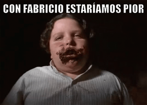 A Boy With Chocolate On His Face And The Words `` Con Fabricio Estariamos Pior '' Above Him . GIF