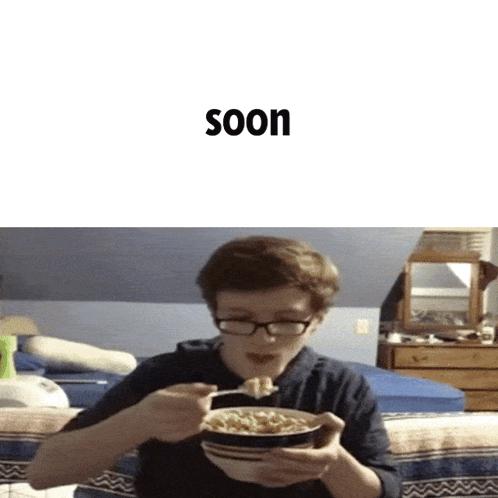 a boy with glasses is eating a bowl of cereal with the word soon behind him