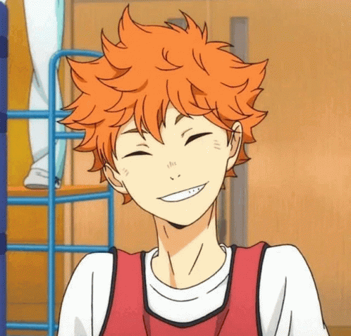 A Boy With Orange Hair Is Smiling With His Eyes Closed And His Mouth Open . GIF
