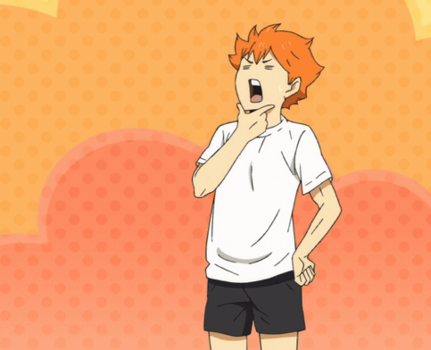 A Boy With Orange Hair Is Wearing A White T-Shirt And Black Shorts GIF