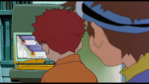 A Boy With Red Hair Is Looking At A Screen With A Picture Of A Person On It GIF