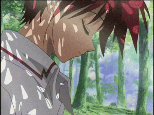 A Boy With Red Hair Is Sleeping In A Forest GIF