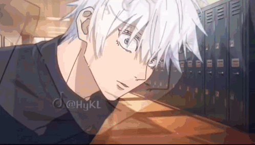 A Boy With White Hair Is Sitting In A Locker Room . GIF