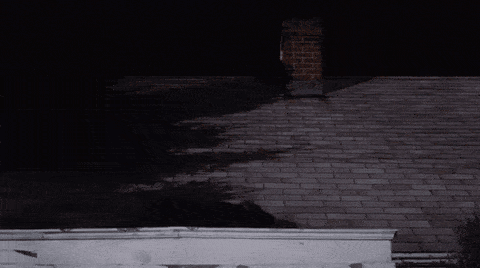 a brick roof with a chimney on top of it