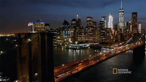 A Bridge Over A Body Of Water With A National Geographic Logo On The Bottom GIF
