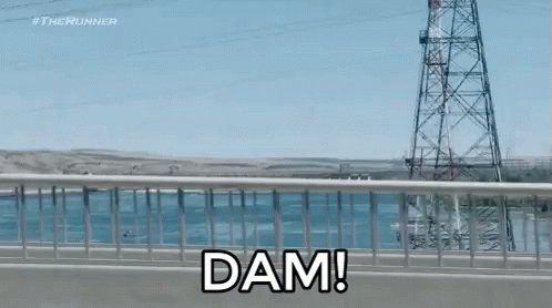 A Bridge Over A Body Of Water With The Words Dam On It GIF