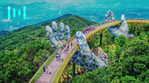 A Bridge That Looks Like A Giant Hand Is Surrounded By Trees And People GIF