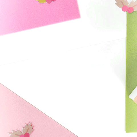 A Brown Envelope With A Pink Ribbon Tied Around It GIF