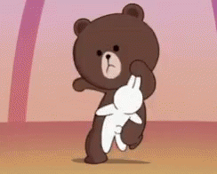 A Brown Teddy Bear Is Holding A White Rabbit In His Paws . GIF