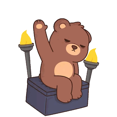 a brown teddy bear is sitting on a box with a torch behind him