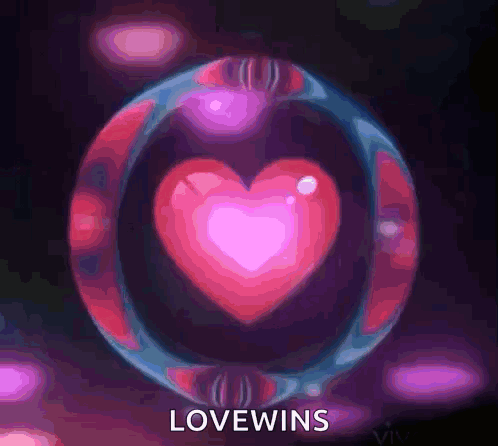 A Bubble With A Heart Inside Of It And The Words Lovewins On The Bottom GIF