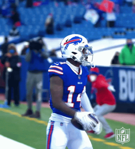 A Buffalo Bills Football Player Is Holding A Football GIF