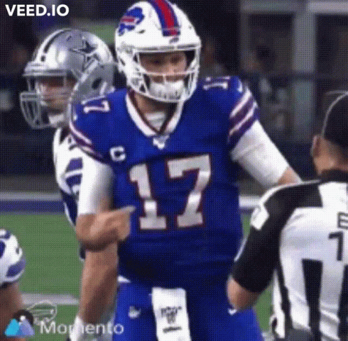 A Buffalo Bills Football Player Is Pointing At A Referee During A Football Game . GIF