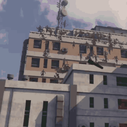 A Building With A Bunch Of People On It GIF