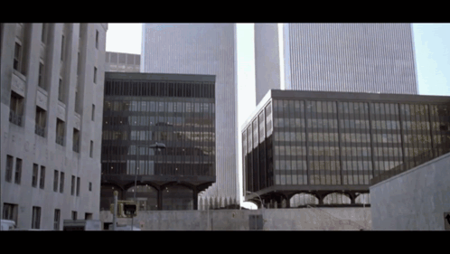 A Building With A Sign That Says No Parking GIF