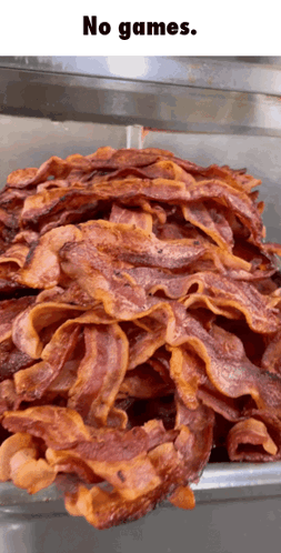 A Bunch Of Bacon Is Stacked On Top Of Each Other And Says No Games GIF