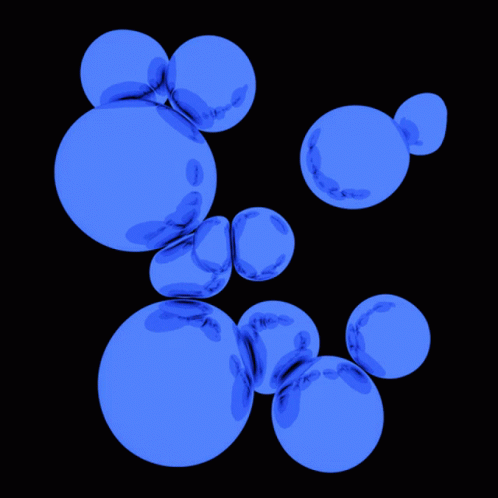 A Bunch Of Blue Bubbles Are Floating In The Air GIF