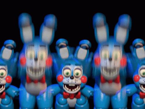 A Bunch Of Blue Stuffed Bunny Rabbits With Red Bow Ties GIF