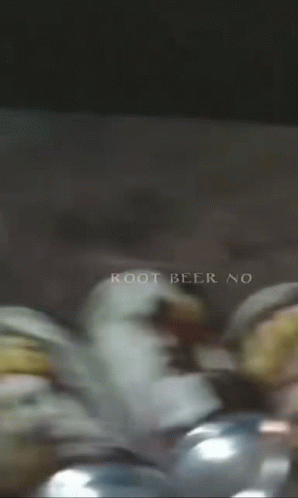A Bunch Of Cans Of Root Beer With The Words Root Beer No On The Bottom GIF