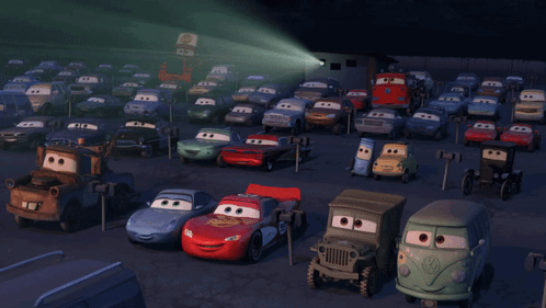 A Bunch Of Cars Are Parked In A Parking Lot And One Of Them Has The Number 55 On It GIF