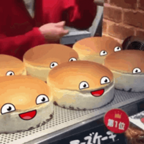A Bunch Of Cheesecakes With Faces On Them GIF