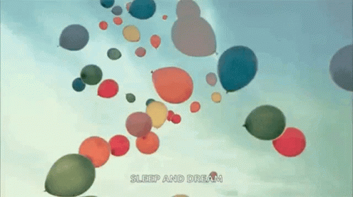 a bunch of colorful balloons flying in the sky with the words sleep and dream written below them